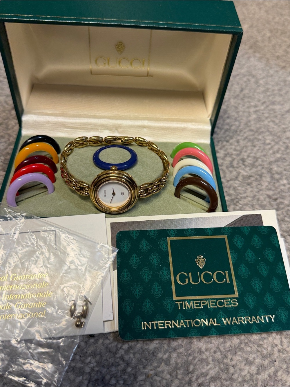 Gucci Gold Bracelet Watch with Interchangeable Colorful Bezels